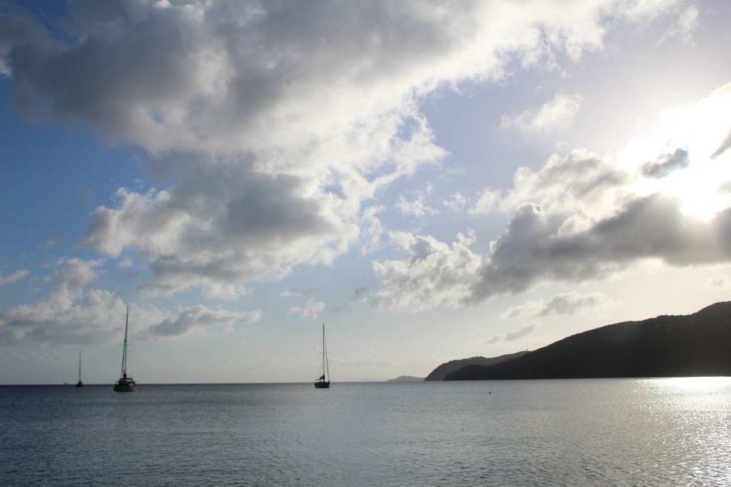 horizon shot of mountains and boats