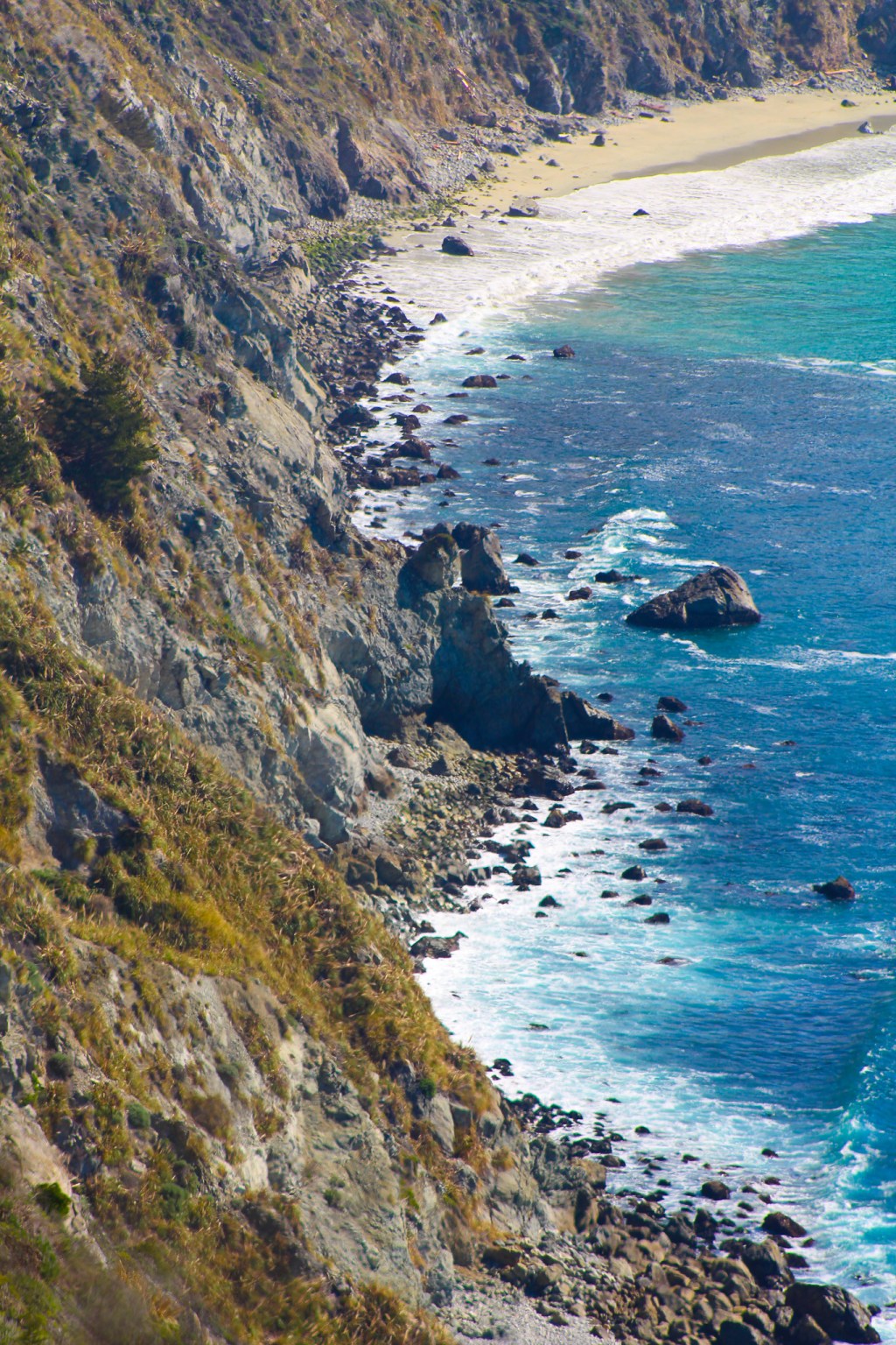 big sur rocky coast with mossy hills